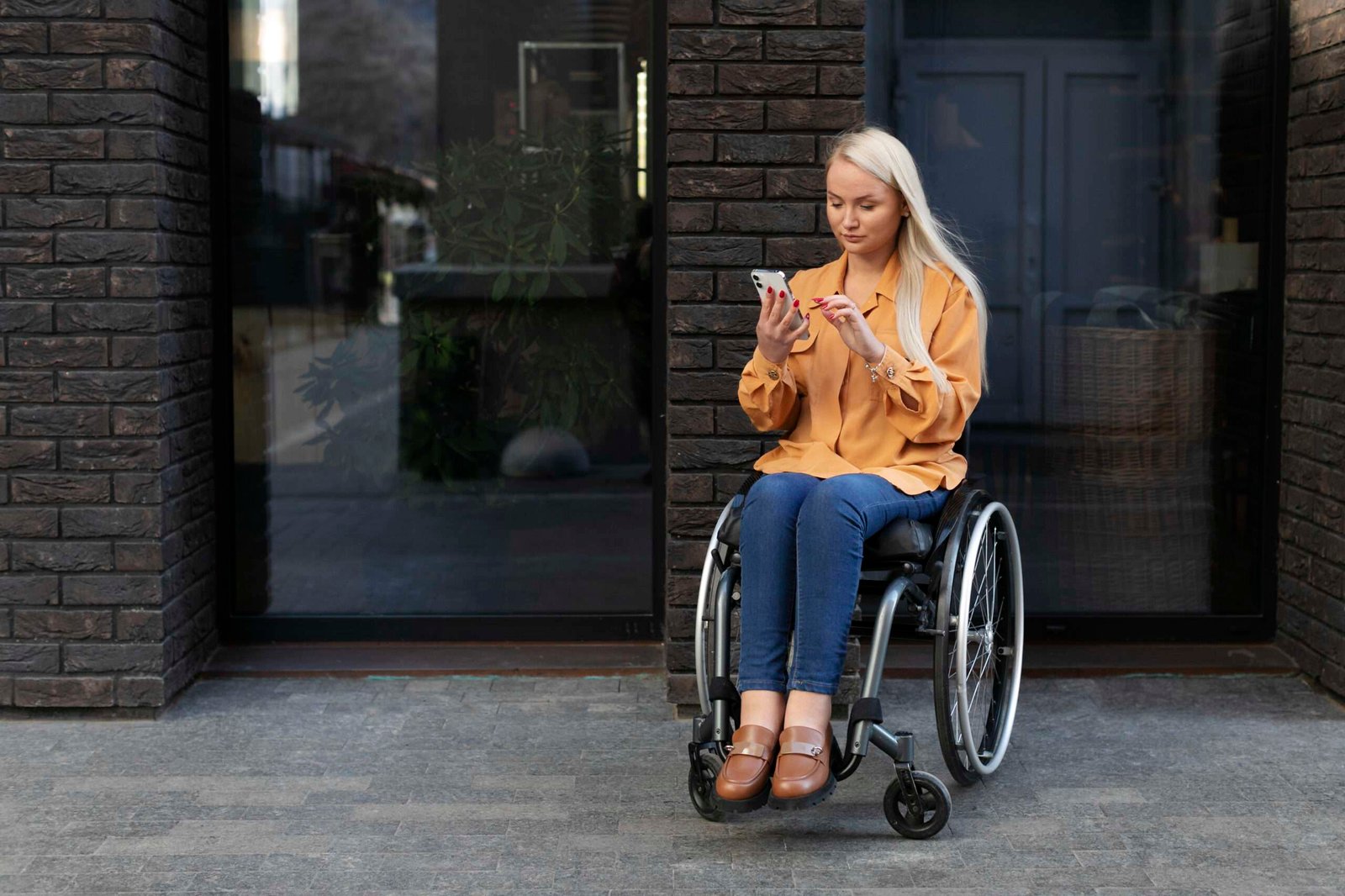 disabled-person-wheelchair-street Must have accessories for wheelchairs